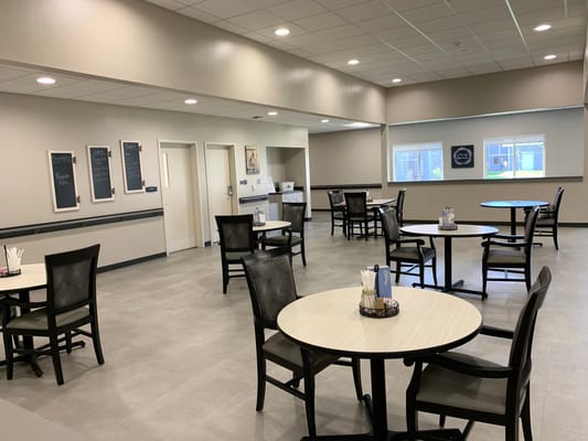 Empty dining area with tables and chairs