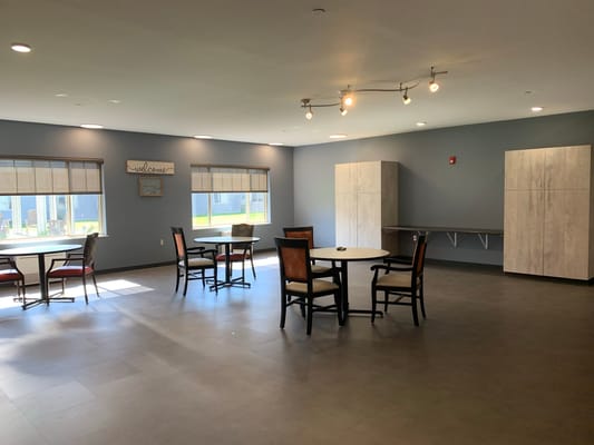 Bright common area with tables and chairs
