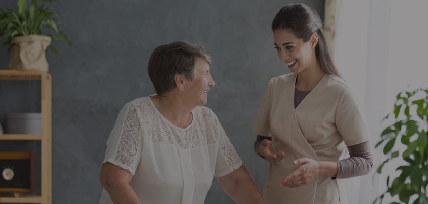 Caregiver and resident interacting in a cozy interior