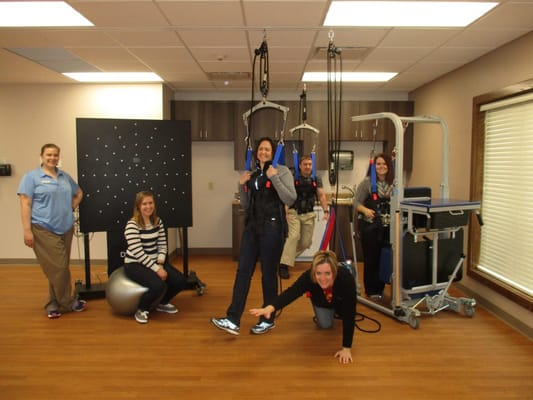 Residents participating in a therapy session with staff support