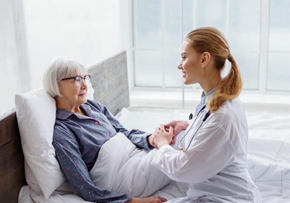 Nurse engaging with a resident in a bright room