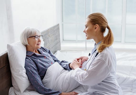 Nurse engaging with a resident in a bright room