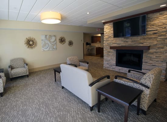 Cozy common area with seating and fireplace