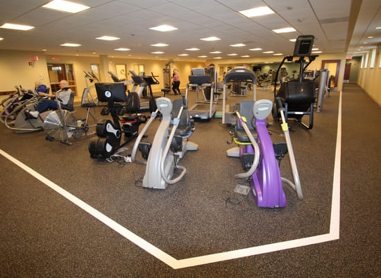 Well-equipped fitness room with exercise machines