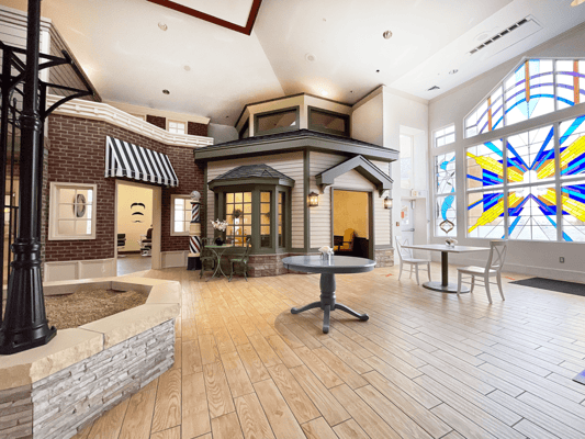 Bright common area with large stained glass windows