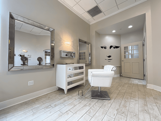 Hair salon area with modern decor and lighting