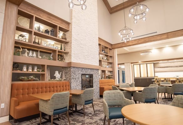 Interior view of a warm common area with seating