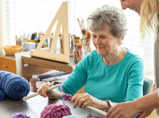 Residents engaging in a knitting activity together