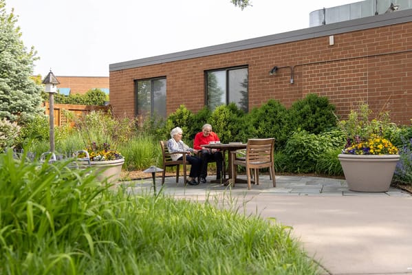 Two residents enjoying time together outdoors