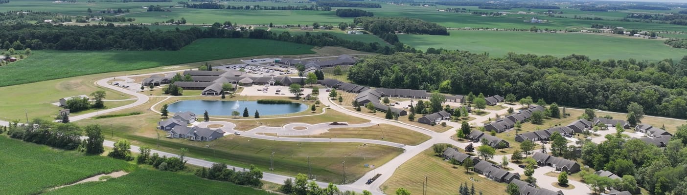Aerial view of a senior living facility with green space