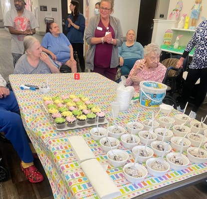 Residents enjoying ice cream and cupcakes in a common area