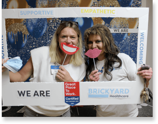 Staff members playfully posing in a common area