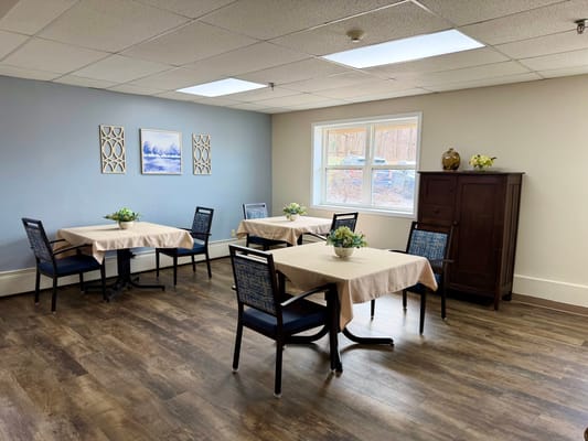 Bright common area with tables and chairs