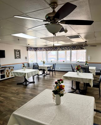 Bright dining area with flower centerpieces