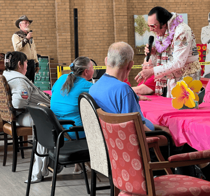 Residents enjoying a performance during an activity event