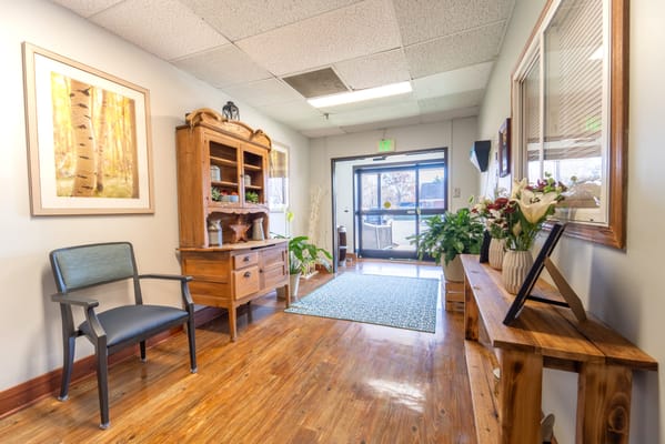 Interior view of a welcoming hallway with plants