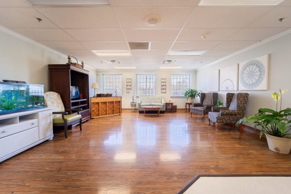 Bright interior common area with seating and plants