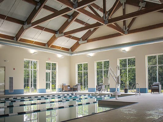 Interior view of a swimming pool area with natural light