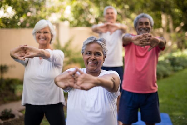 Residents participating in an outdoor yoga class