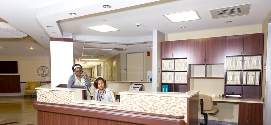 Reception area with staff at the front desk