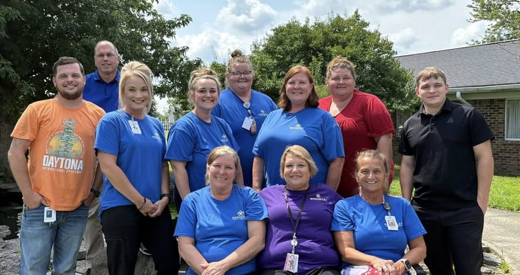 Group of staff members posing outdoors