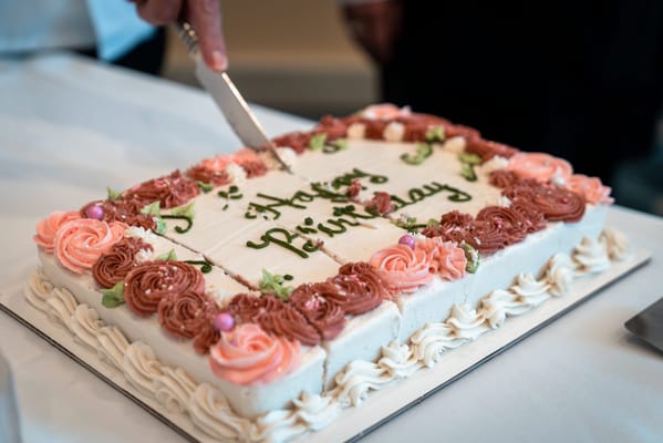 Close-up of a birthday cake being cut