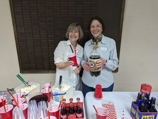 Two residents enjoying ice cream at a celebration