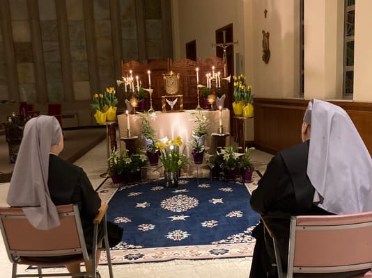 Two residents in a serene chapel setting