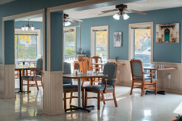 Bright dining room with wooden tables and chairs
