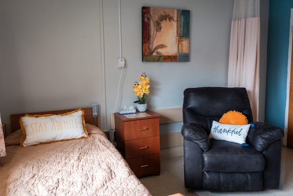 Cozy resident room with comfortable furniture and decor