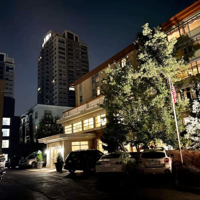 Night view of a senior living facility with lights on
