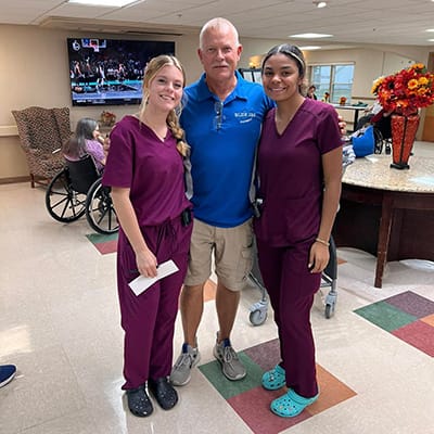 Staff members and residents in a common area