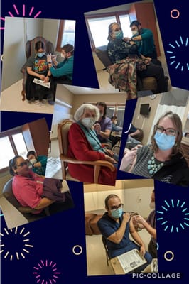 Residents participating in a vaccination event indoors