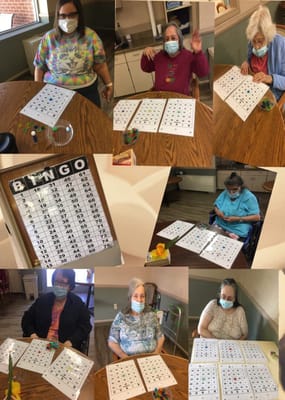 Residents enjoying a bingo game in the activity room