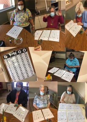 Residents enjoying a bingo game in the activity room