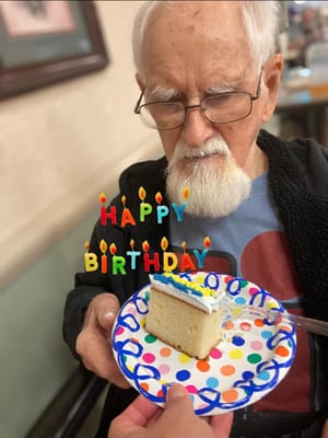 Resident celebrating a birthday with cake