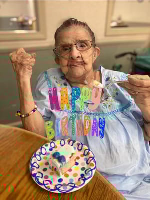 Resident celebrating birthday with cake