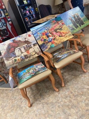 Art displays on chairs in a common area