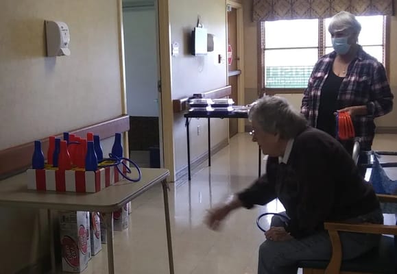 Residents engaging in an activity inside the facility