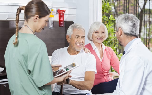 Residents and staff interacting in a care setting