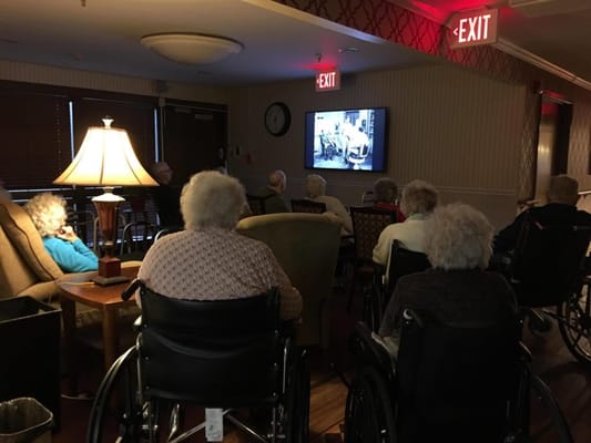 Residents watching a film together in a common area