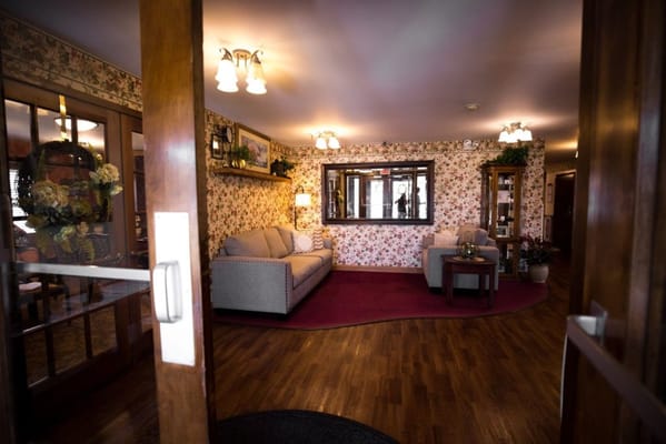 Cozy interior lounge area with floral wallpaper