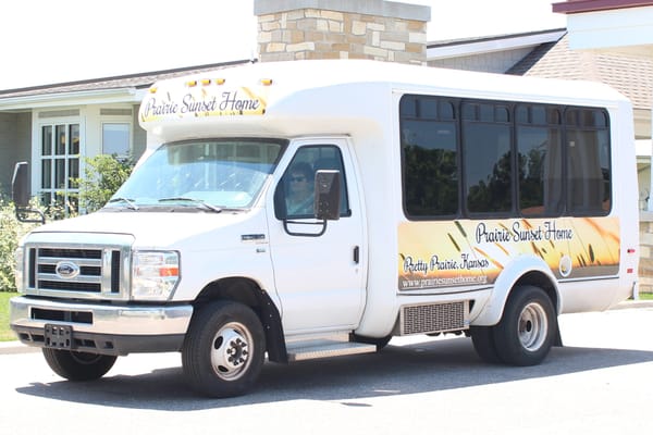 Facility transport van parked outside the building