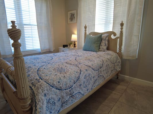 Cozy bedroom with a single bed and patterned bedding