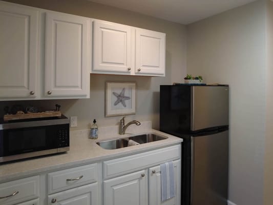Interior kitchen space with cabinets and appliances