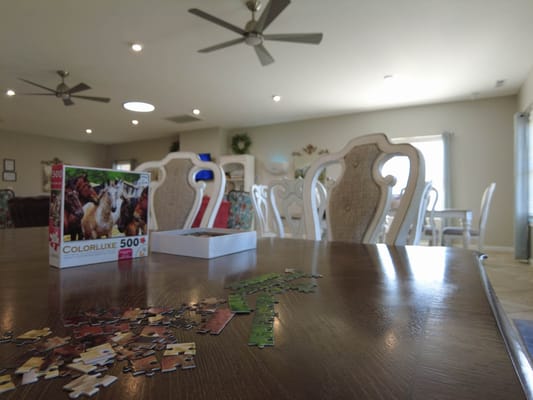 A table set for a puzzle activity in a common area