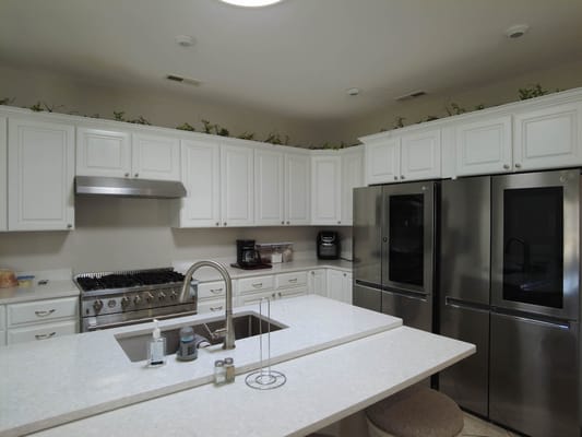 A bright kitchen with modern appliances and cabinetry