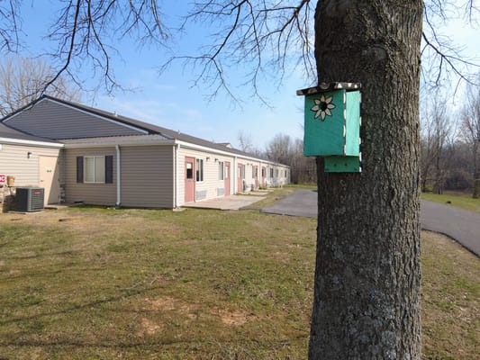 Exterior view of assisted living facility with birdhouse