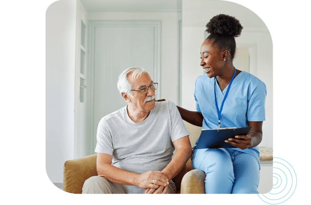 Caregiver interacting with a resident in a bright room