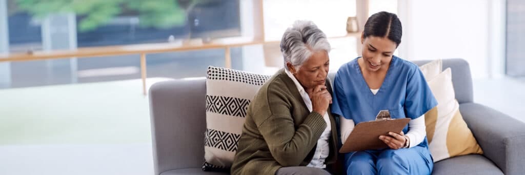 Caregiver showing a document to a resident
